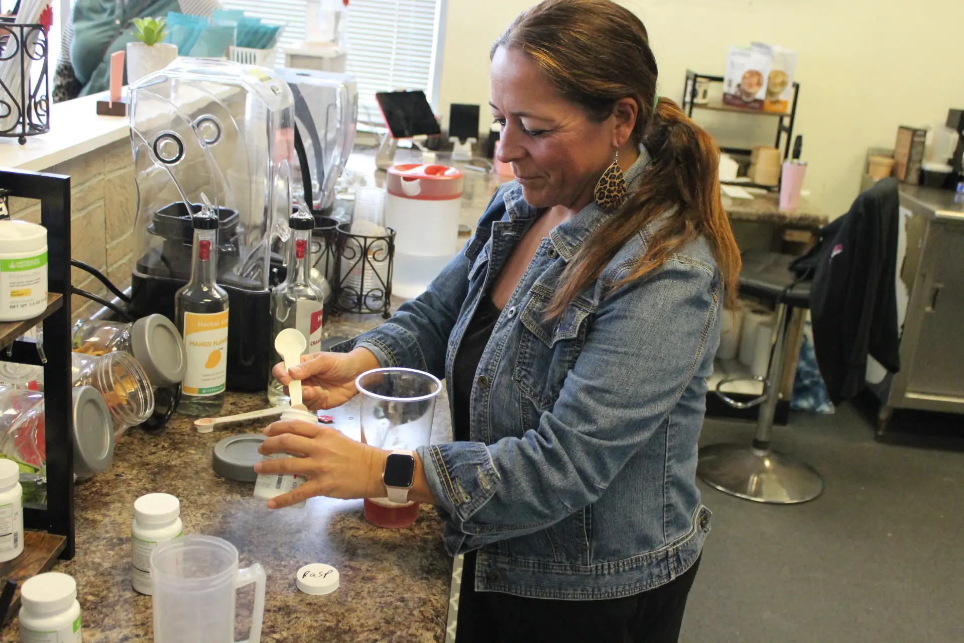 Kim mixing a drink
